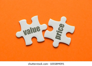 The Word Value Price On Two Matching Puzzle On Orange Background.