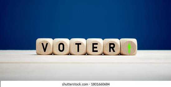 The Word Voter With Upward Arrow On Wooden Cubes. Elections And Increasing Voter Turnout Concept.