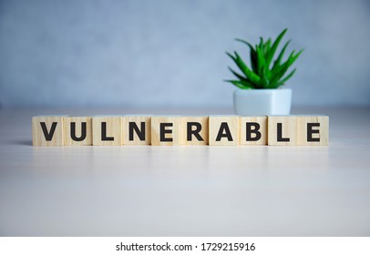 Word Vulnerability On Wooden Cubes, Concept Background.