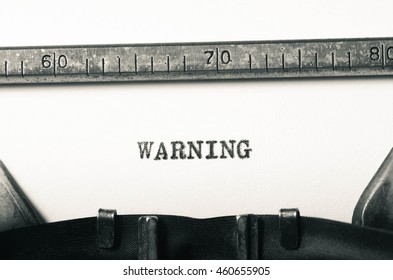 word warning typed on old typewriter - Shutterstock ID 460655905