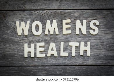 The Word Womens Health On The Wooden Floor