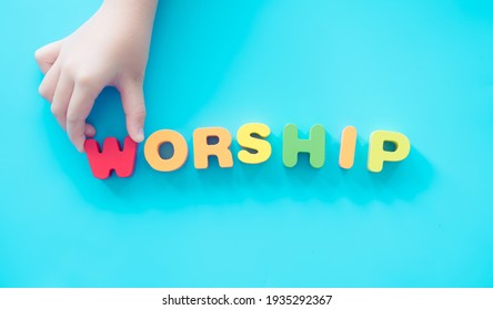 The word "Worship" and kid hands for sunday school service.kid church good friday and easter day in church christian background.Sunday service.Online worship.Faith Praise to Jesus.pray.bible study.