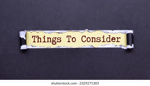 Word writing text Things To Consider. Business concept for think about something carefully in order to make decision Cardboard which is torn in the middle placed above a wooden classic table. - Shutterstock ID 2329271303