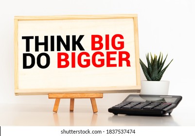 Word Writing Text Think Big Do Bigger. Business Concept For Raise The Bar And Aim Far Higher Than The Usual.