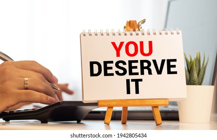 Word Writing Text You Deserve It. Business Concept For Reward For Something Well Done Deserve Recognition Award Blacky Wooden Desk Laid Paper Clip Randomly One Hold Yellow Board With Text.