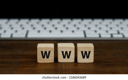 Word Www, World Wide Web Written On Wooden Block With White Computer Keyboard. Online Communication Or Web Browsing Concept.