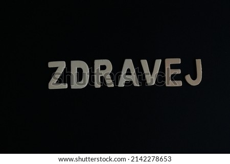 Word 'Zdravej' on black background. Zdravej is the word for Bulgarian say Hello or greetings.