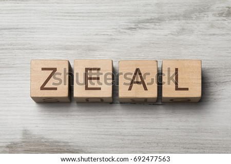 word ZEAL written on wooden cubes