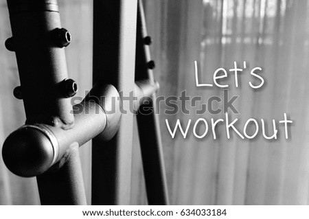 Wording 'let's workout' on an exercise machine picture