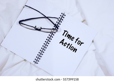 Wording TIME FOR ACTION on notebook with spectacle at bed. Move on Motivation Concept