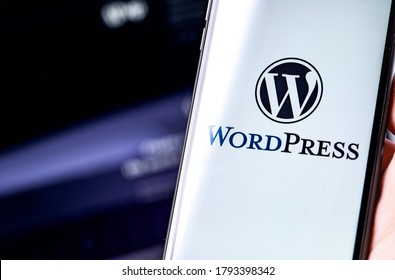 WordPress logo on the screen smartphone and notebook background closeup. WordPress - open source site content management system. Moscow, Russia - June 24, 2020