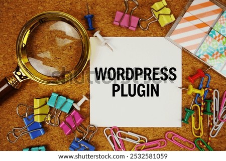 Wordpress Plugin text on paper card with magnifying glass and stationery on cork board background