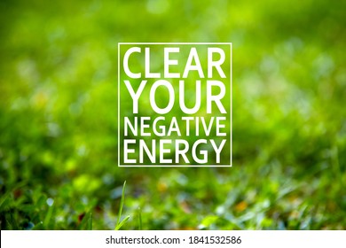 The Words Clear Your Negative Energy Written On Garden Green Grass Background. Healing Your Mind In Nature Concept. 