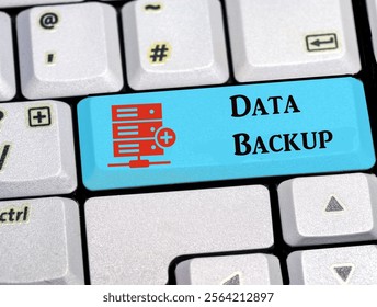 The words data backup on a computer keyboard