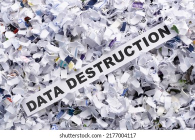 Words Data Destruction On Top Of Heap Of Cross Shredded Paper Concept Top View