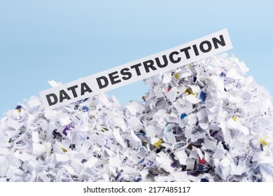 Words Data Destruction On Top Of Heap Of Cross Shredded Paper Concept