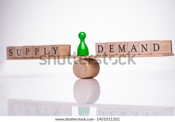 Words\
Demand And Supply Wooden Block Balancing On\
Seesaw
