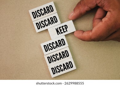 The words discard or keep. The concept of saving or not wasting. chosen to keep