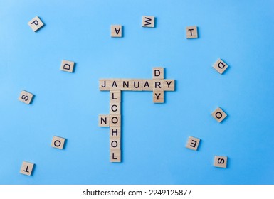 Words Dry January and No Alcohol made up of wooden blocks with letters. Concept of sobriety and abstinence after New Year holidays. Alcohol-free challenge - Powered by Shutterstock