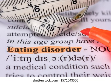 Words eating disorder with highlighter and measuring tape - Shutterstock ID 1571543503