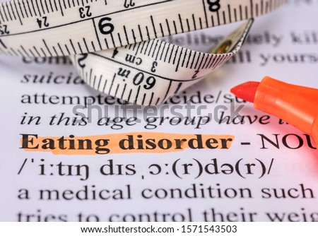 Words eating disorder with highlighter and measuring tape