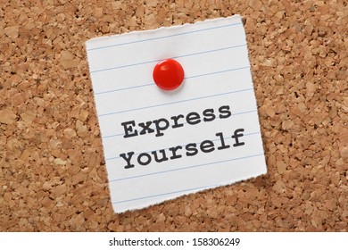 The words Express Yourself typed on a scrap of lined paper pinned to a cork notice board. 