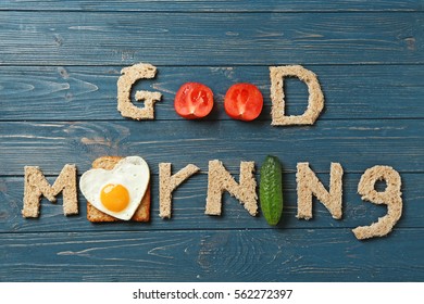 Words GOOD MORNING Made With Food On Wooden Background