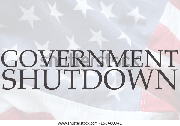 the words\
government shutdown on an old USA flag\
