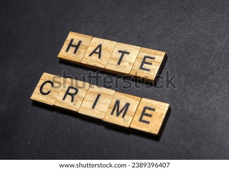 the words hate crime on wooden squares