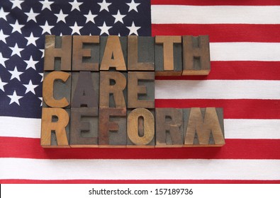 The Words Health Care Reform On A USA Flag