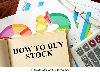 Words How To Buy Stock Written On A Book. Business Concept.