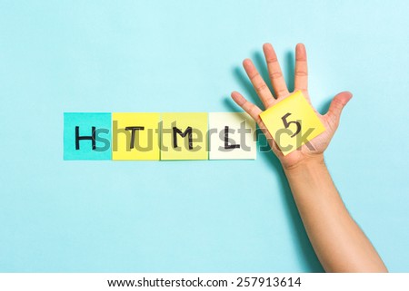 The words HTML5 on blue background and hand showing the 5 number. HTML5 is a language of the Internet.