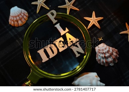 The words 'IDEA' and 'PLAN' are clearly visible through a magnifying glass, surrounded by seashells, illustrating a deep dive into concepts and strategic planning.