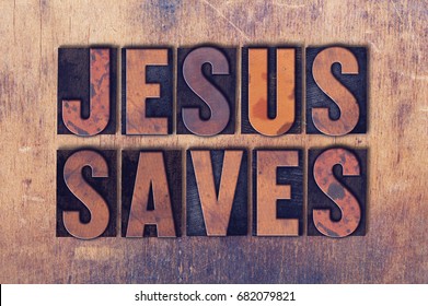 The words Jesus Saves concept and theme written in vintage wooden letterpress type on a grunge background.