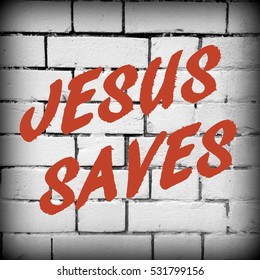 The words Jesus Saves in red text on a black and white brick wall background. A vignette has been added for effect