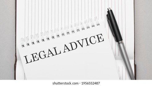 Words Legal Advice Text On Notepad And Pen