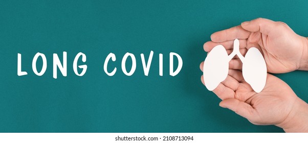 The Words Long Covid Are Standing On A Paper, Hands With A Lung, Breathing Problems After Covid-19 Disease