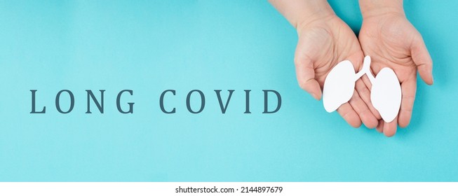 The Words Long Covid Are Standing On A Paper, Hands Hold A Lung, Breathing Problems After Covid-19 Disease 