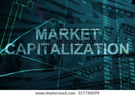 Words Market capitalization  with the trading data on the background.