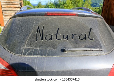 The Words NATURE On The Dusty, Dirty Windscreen Of A Car. Norway.