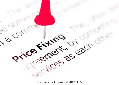 Words PRICE FIXING pinned on white paper with red pushpin, available copy space. Business Concept