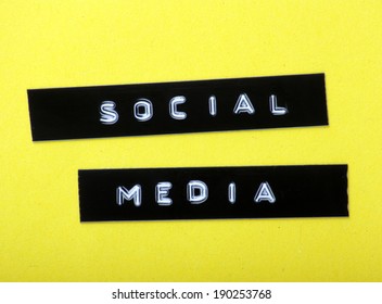 The Words Social Media Made Into Labels With An Embossed Letter Label Maker And Fixed To A Yellow Paper Background