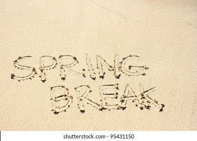 The Words Spring Break Written In The Sand On A Beach