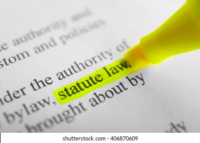 Words Statue law highlighted with a yellow marker - Shutterstock ID 406870609