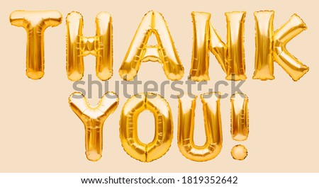 Words THANK YOU made of golden inflatable balloons. Thank you greeting card, gold balloons lettering