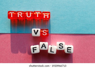 the words truth and lie are made up of cubes on different colored backgrounds. confrontation between truth and lies