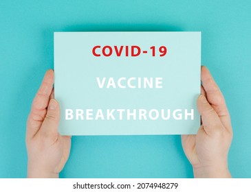 The Words Vaccine Breakthrough Why Are Standing On A Paper, Hands Hold The Message, Covid-19 Vaccination