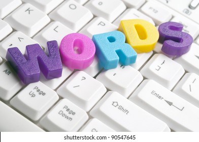 Words word made by colorful letters on keyboard