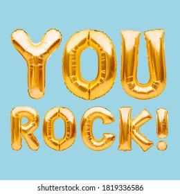Words YOU ROCK made of golden inflatable balloons isolated on blue. Motivation, slang positive affirmation words, gold balloons lettering, message you are the best.