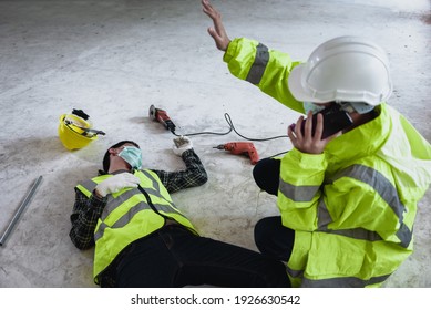 Work Accidents Of Worker In Workplace At Construction Site Area And Unconscious With Colleague Motion And Call To The Safety Officer For Rescue And Life-saving. Selection Focus On An Injured Person.